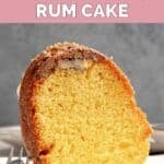 A slice of Ms. Bessie's New Orleans rum cake and a fork on a plate.