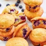 Homemade Otis Spunkmeyer blueberry muffins and fresh blueberries.
