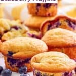 Several homemade Otis Spunkmeyer blueberry muffins.