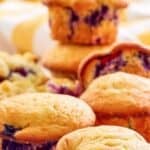 Homemade Otis Spunkmeyer blueberry muffins on parchment paper.