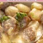 Creamy alfredo sausage and gnocchi bake garnished with fresh parsley.