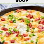 Homemade Black Angus baked potato soup garnished with bacon, cheese, green onions, and sour cream.