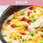 A bowl of Black Angus Steakhouse baked potato soup loaded with toppings.