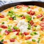 Homemade Black Angus Steakhouse baked potato soup in a bowl.