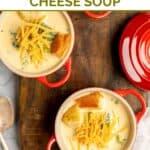 Bowls of homemade Black-eyed Pea broccoli cheese soup on a wooden serving board.