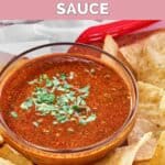 A small bowl of copycat Chipotle red chimichurri sauce garnished with cilantro.