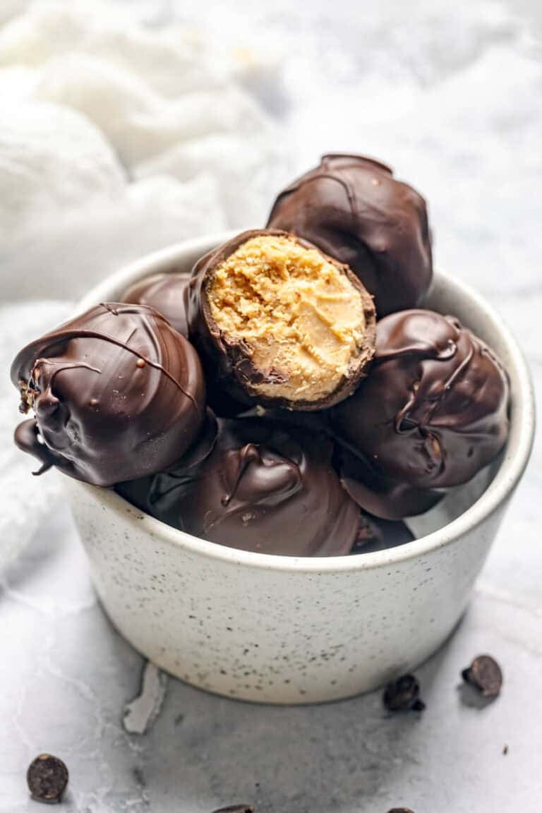 Homemade chocolate peanut butter balls in a bowl.