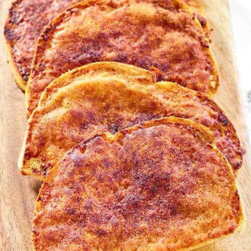 Copycat North Woods Inn garlic cheese bread on a wood serving board.