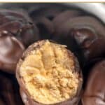 Peanut butter balls covered in chocolate in a bowl.