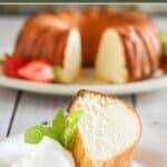 A slice of Scandinavian almond cake on a plate and the bundt cake behind it.