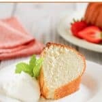 Homemade Scandinavian almond cake slice, dollop of whipped cream, and fresh mint leaves.