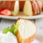 Scandinavian almond cake slice served with whipped cream on a plate.