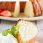 A slice of homemade Scandinavian almond cake, whipped cream, and fresh mint on a plate.