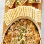 Hot boudin dip served with crackers.