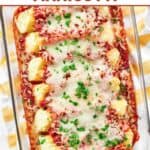 Homemade four cheese manicotti in a Pyrex glass baking dish.