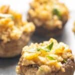 Three Ritz cracker stuffed mushrooms.