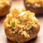 Ritz cracker stuffed mushroom on a platter.