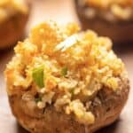 Ritz cracker stuffed mushroom on a plate.