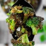 Air fryer broccoli on a serving spoon.