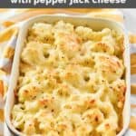 Cheesy and spicy cauliflower bake on top of a kitchen towel and ready to be served.