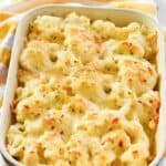 A baking dish filled with spicy cauliflower cheese bake.