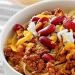 Cincinnati chili topped with cheese, onions, and beans.