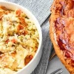 Creamy chicken pot pie baked and a serving in a small bowl.
