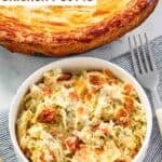 A baked chicken pot pie and a serving in a bowl beside it.