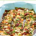 An appetizer of marinated cheeses to serve with crackers.