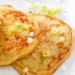 Two potato pancakes made with leftover mashed potatoes.