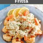 Shrimp covered in a creamy white wine lemon butter sauce in a bowl.