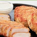 Crispy breaded pork chops served with a creamy sauce.