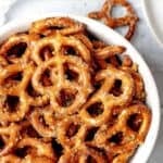 Homemade ranch pretzels in a small bowl.