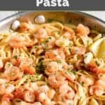 A skillet of shrimp and garlic pasta.