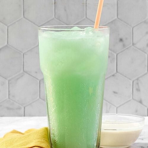 A glass of copycat Taco Bell Dirty Mountain Dew Baja Blast dream soda.