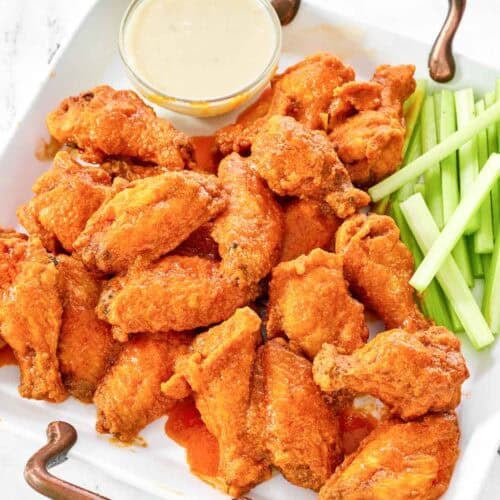 Copycat Wings and Things garlic buffalo wings on a platter.