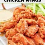 Homemade Wings and Things garlic buffalo wings served with blue cheese dressing and celery sticks.