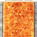 Cheesy hashbrown casserole in a glass baking dish.