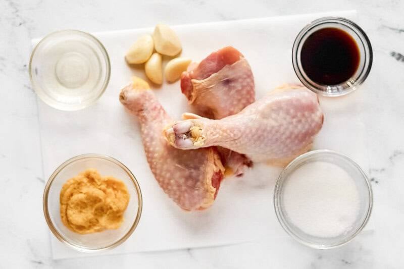Chicken drumsticks, miso paste, soy sauce, garlic, sugar, and mirin.