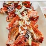 Spare ribs with Chinese BBQ sauce on a platter.