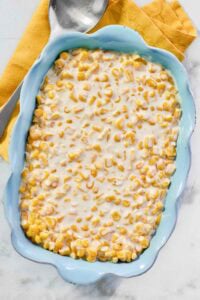 Creamy corn dish in an elegant serving dish.