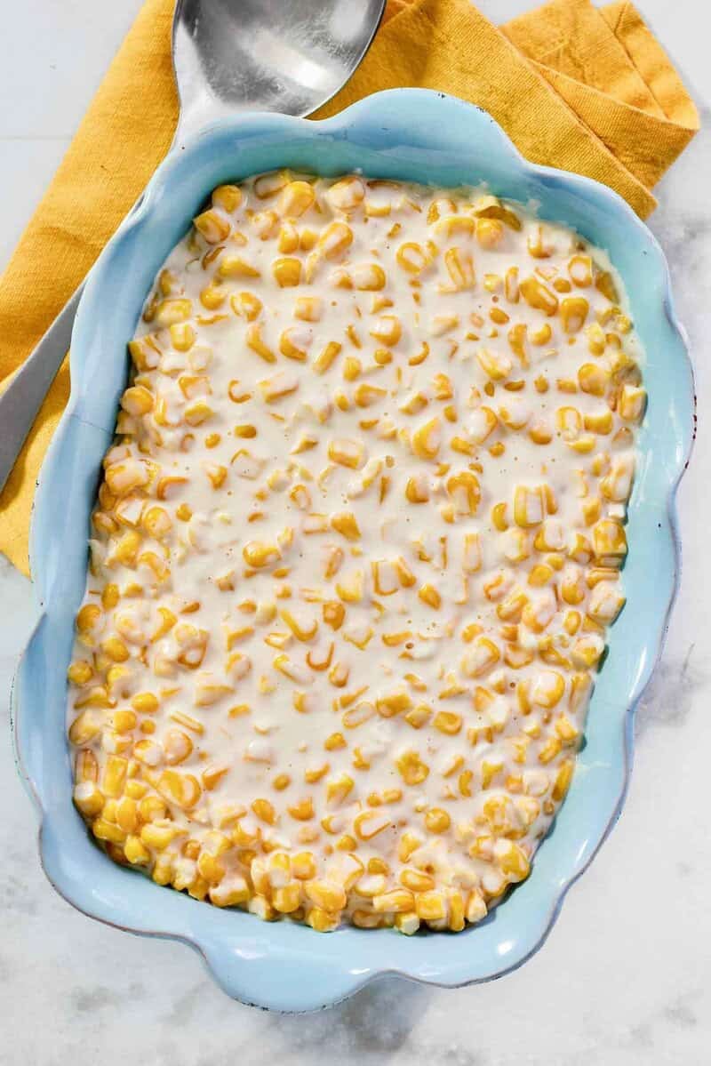 Creamy corn dish in an elegant serving dish.