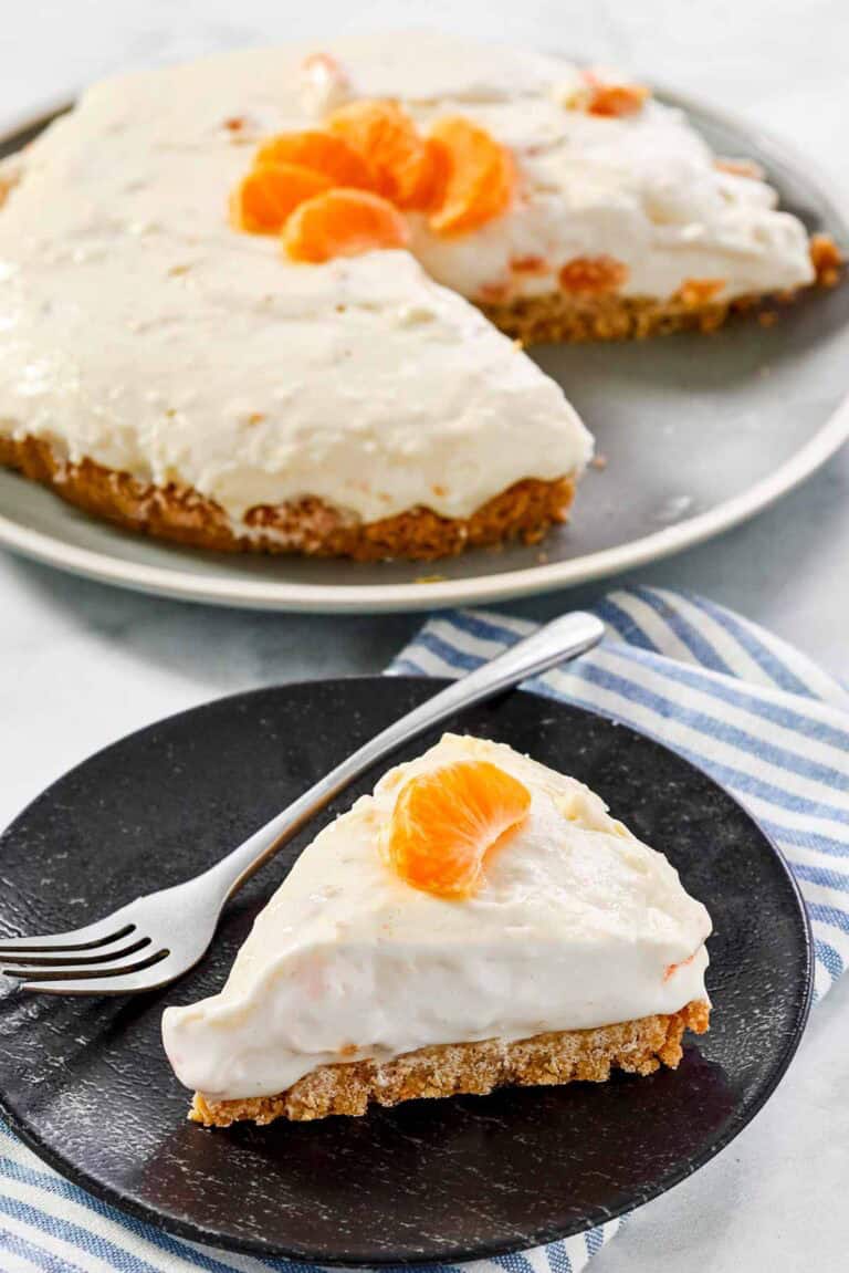 Creamy cheesecake made with mandarin oranges and topped with orange slices.