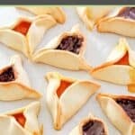 Apricot and chocolate hamentashen cookies on parchment paper.