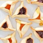 Homemade hamentashen cookies with apricot and chocolate filling.