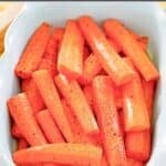 Roasted carrots with honey glaze in a serving dish.