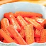 Glazed honey roasted carrots in a serving dish.