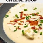 Cozy, creamy beer cheese soup topped with bacon bits and chives.