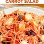 Copycat Luby's shredded carrot salad with raisins and pineapple on a plate.