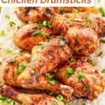 Baked glazed chicken drumsticks served over rice.